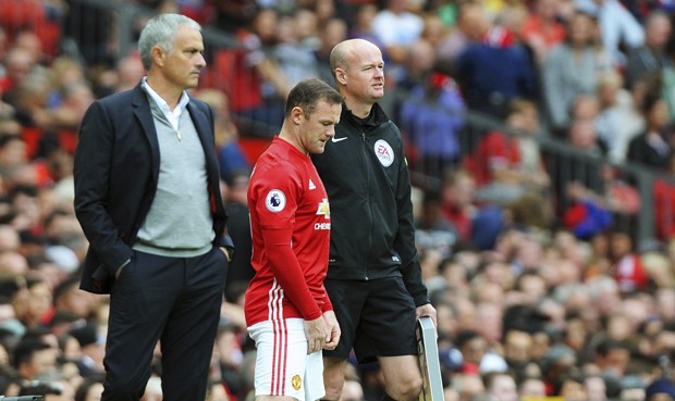 Wayne Rooney playing for Manchester United alongside manager Jose Mourinho