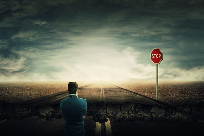 chasm in road huge gap stop sign