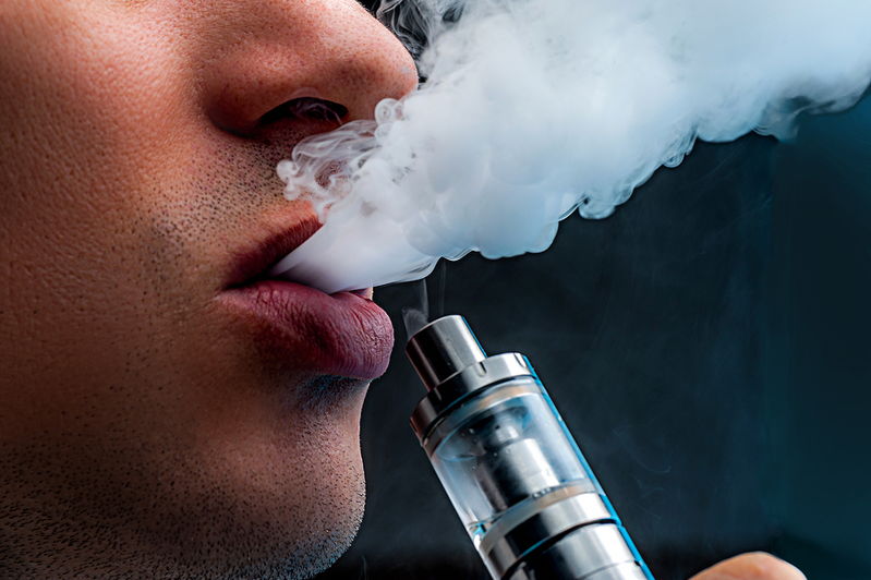 close up man vaping