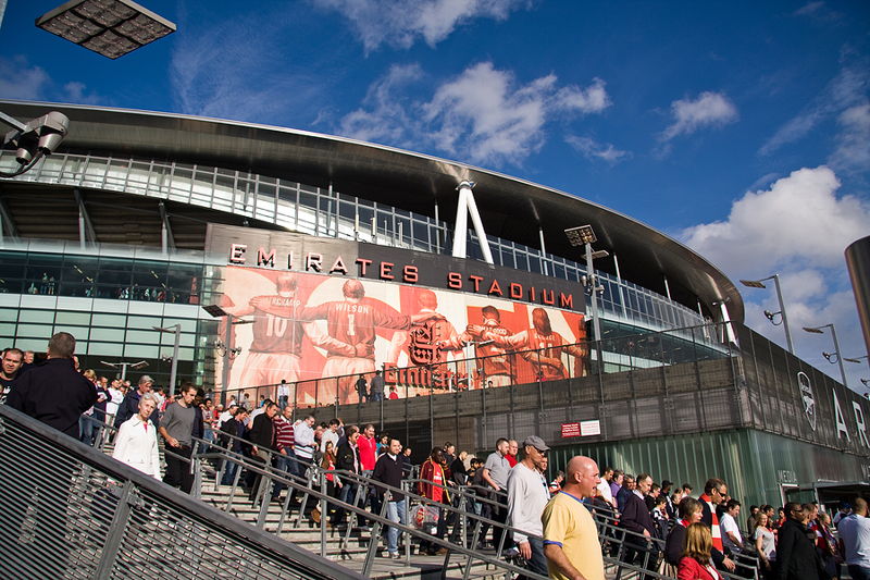 fan exiting arsenal emirate stadium on sunny day