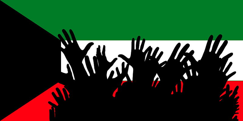 kuwait flag hands silhouetted in front
