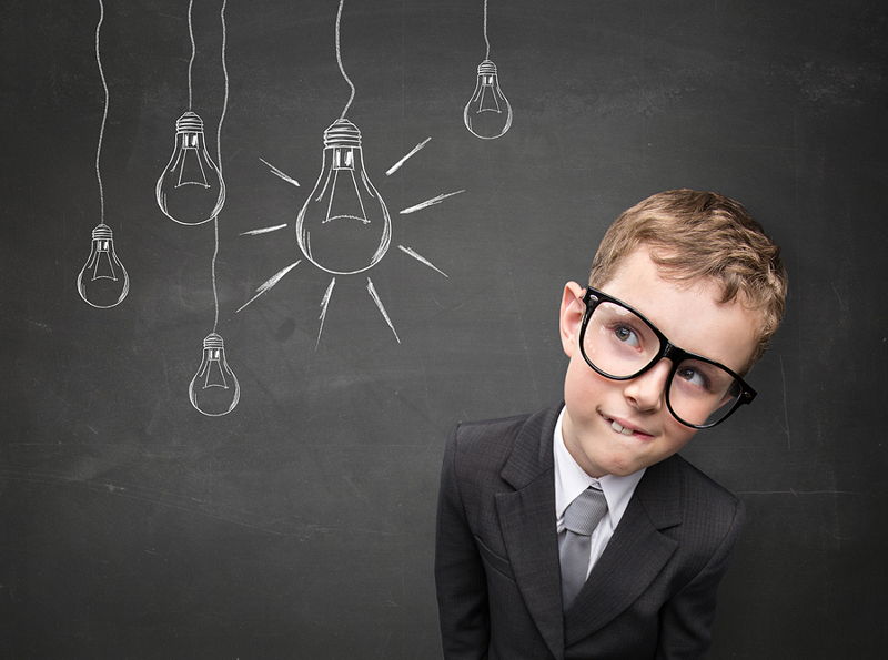 kid dressed in suit bright idea manager
