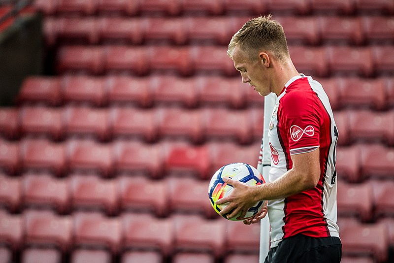 james ward-prowse picks up ball to take free kick
