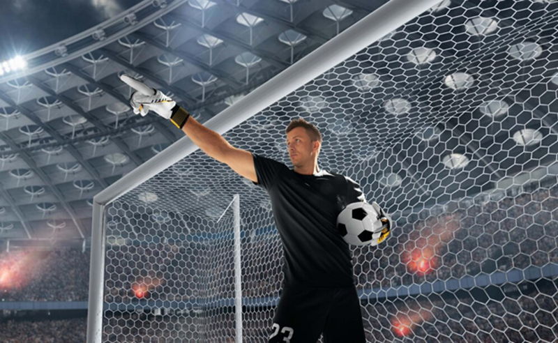 goalkeeper in goal pointing