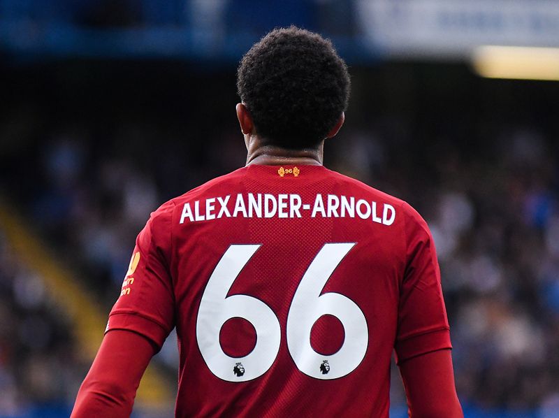 trent alexander arnold shown from back playhing for liverpool wearing 66